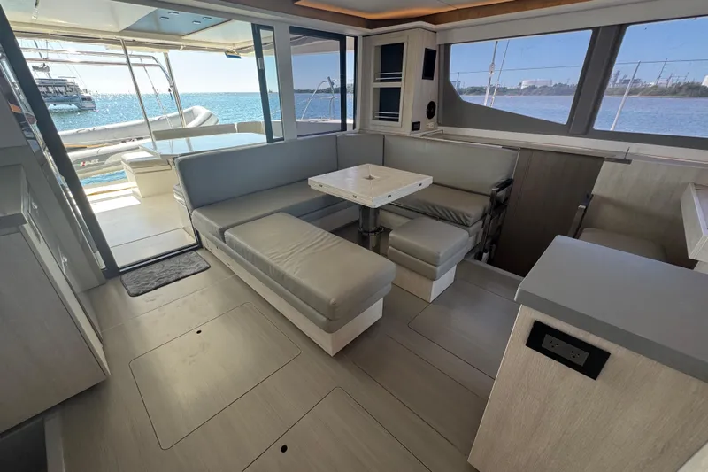 Ce Ya Yacht Photos Pics Modern interior of 2021 Leopard 45 yacht with spacious seating and ocean view.