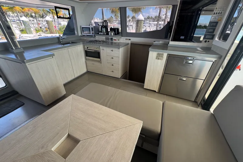 Ce Ya Yacht Photos Pics Modern kitchen interior of 2021 Leopard 45 yacht with sleek cabinetry and appliances.