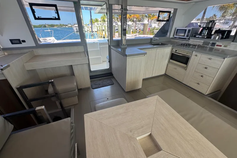 Ce Ya Yacht Photos Pics Modern kitchen interior of 2021 Leopard 45 yacht with ocean view.