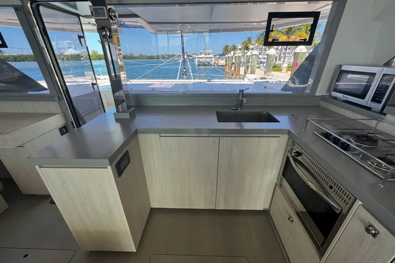 Ce Ya Yacht Photos Pics Modern kitchen interior on a 2021 Leopard 45 catamaran with ocean view.