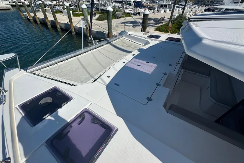 Ce Ya Yacht Photos Pics 2021 Leopard 45 catamaran deck view at marina, showcasing spacious layout and sleek design.