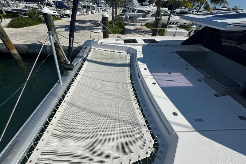 Ce Ya Yacht Photos Pics 2021 Leopard 45 catamaran docked, featuring spacious deck and netting area.