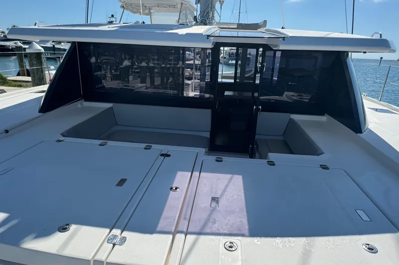 Ce Ya Yacht Photos Pics 2021 Leopard 45 catamaran deck with seating area and ocean view.