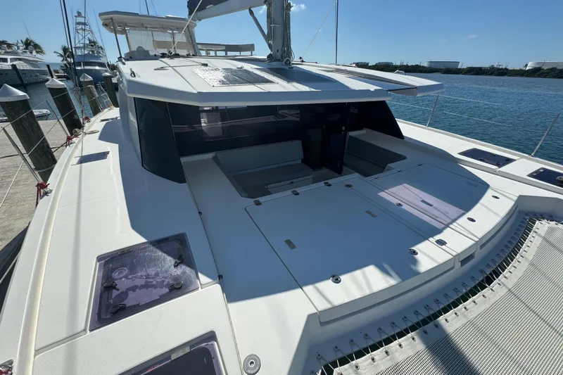 Ce Ya Yacht Photos Pics 2021 Leopard 45 catamaran docked at marina, showcasing spacious deck and modern design.