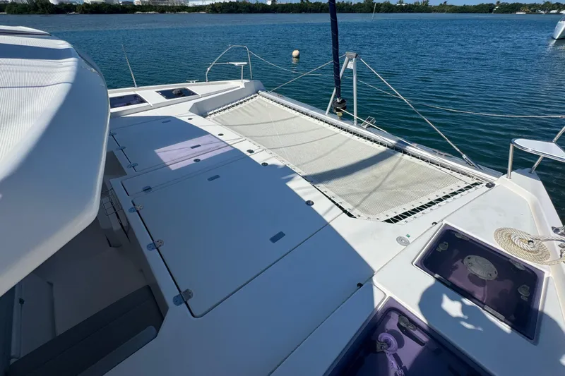 Ce Ya Yacht Photos Pics Leopard 45 catamaran deck with netting, 2021 model, on calm blue water.