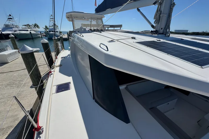Ce Ya Yacht Photos Pics 2021 Leopard 45 catamaran docked, featuring solar panels and sleek design.