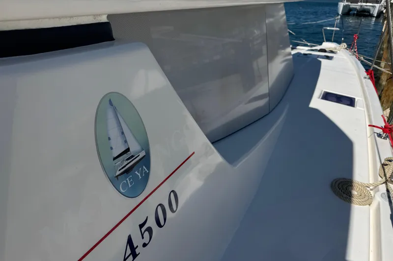 Ce Ya Yacht Photos Pics 2021 Leopard 45 catamaran docked, featuring sleek design and nautical emblem.