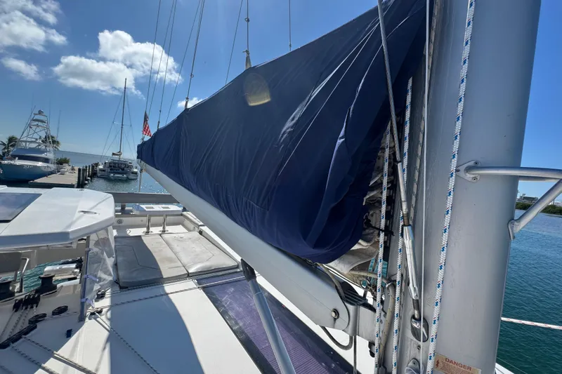 Ce Ya Yacht Photos Pics Sailboat Leopard 45, 2021 model, docked with covered sail, sunny day, marina view.