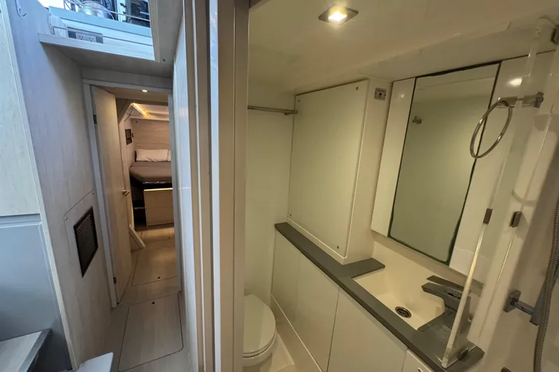 Ce Ya Yacht Photos Pics Interior of 2021 Leopard 45 yacht showing bathroom and bedroom corridor.