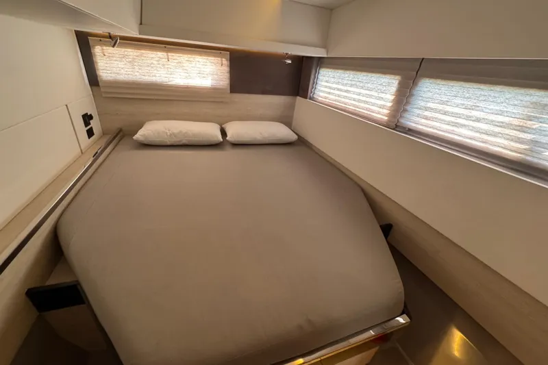 Ce Ya Yacht Photos Pics Luxurious bedroom interior of 2021 Leopard 45 yacht with modern design and cozy bedding.