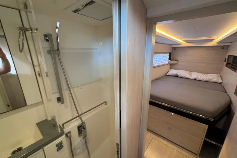 Ce Ya Yacht Photos Pics Modern Leopard 45 yacht interior with cozy bedroom and sleek bathroom, 2021 model.