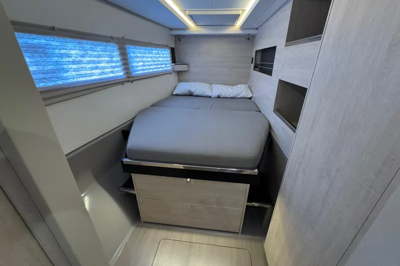 Ce Ya Yacht Photos Pics Modern bedroom interior in a 2021 Leopard 45 yacht, featuring a cozy bed and sleek design.