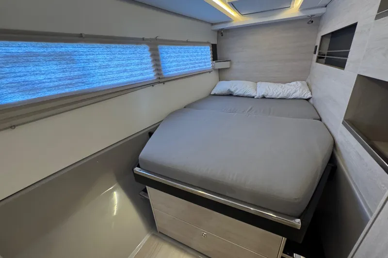 Ce Ya Yacht Photos Pics Modern bedroom interior on a 2021 Leopard 45 yacht, featuring a cozy bed and sleek design.