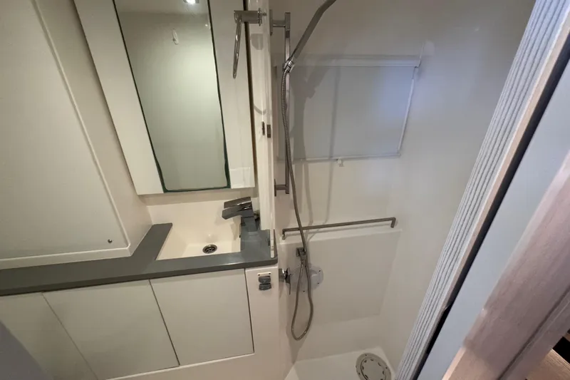 Ce Ya Yacht Photos Pics Modern bathroom interior of 2021 Leopard 45 yacht, featuring sleek fixtures and shower.