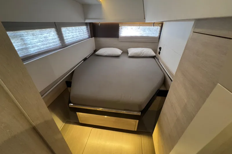 Ce Ya Yacht Photos Pics Modern bedroom interior in 2021 Leopard 45 yacht, featuring a cozy double bed.