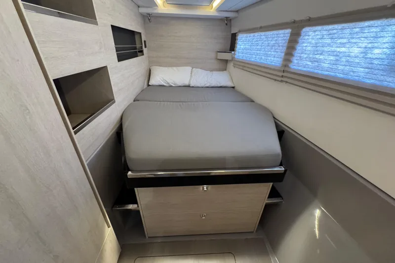 Ce Ya Yacht Photos Pics Interior cabin of 2021 Leopard 45 yacht with modern bed and storage.