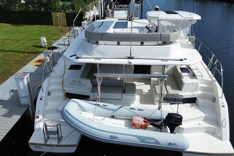 Ce Ya Yacht Photos Pics 2021 Leopard 45 yacht docked with inflatable boat on stern.