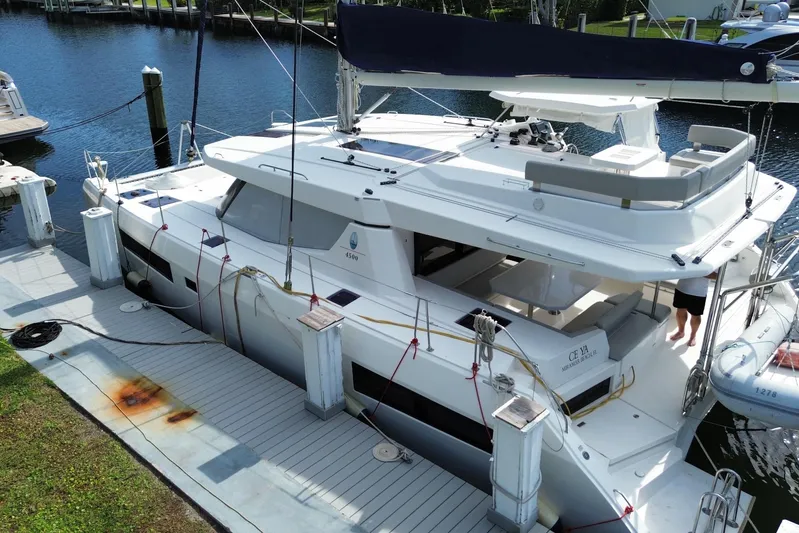 Ce Ya Yacht Photos Pics 2021 Leopard 45 catamaran docked at marina, featuring spacious deck and modern design.