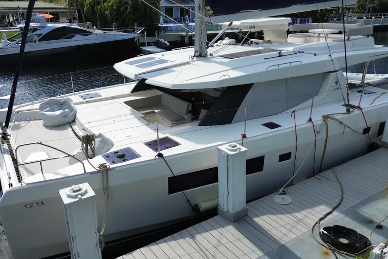 Ce Ya Yacht Photos Pics 2021 Leopard 45 catamaran docked, featuring spacious deck and modern design.