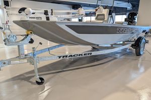 2026 Tracker Bass Tracker Classic CC boat on trailer in showroom.