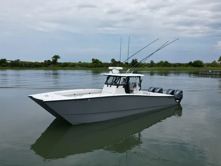  Yacht Photos Pics 2017 Freeman 37 VH boat on calm water with triple outboard engines.