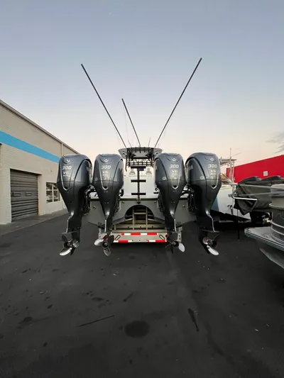  Yacht Photos Pics Freeman 37 VH 2017 boat with four powerful outboard engines in a parking lot.