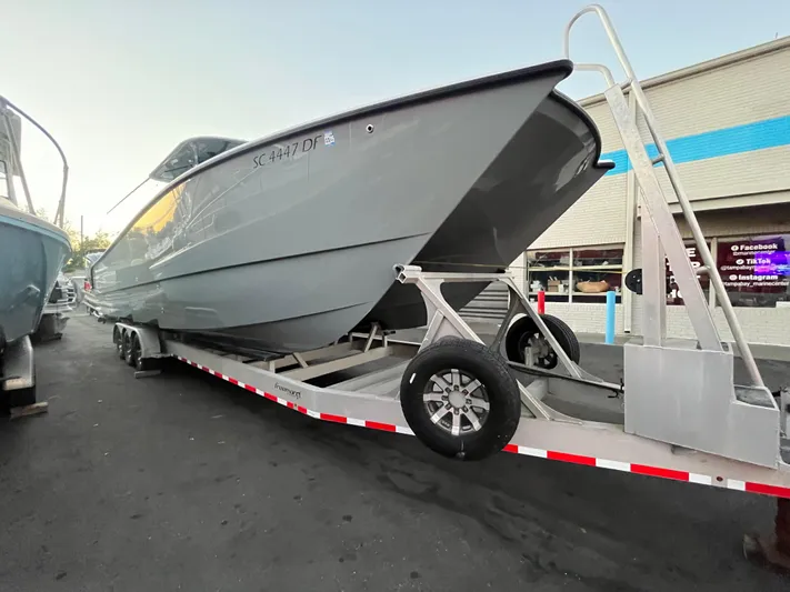  Yacht Photos Pics 2017 Freeman 37 VH boat on trailer, parked outside a building.