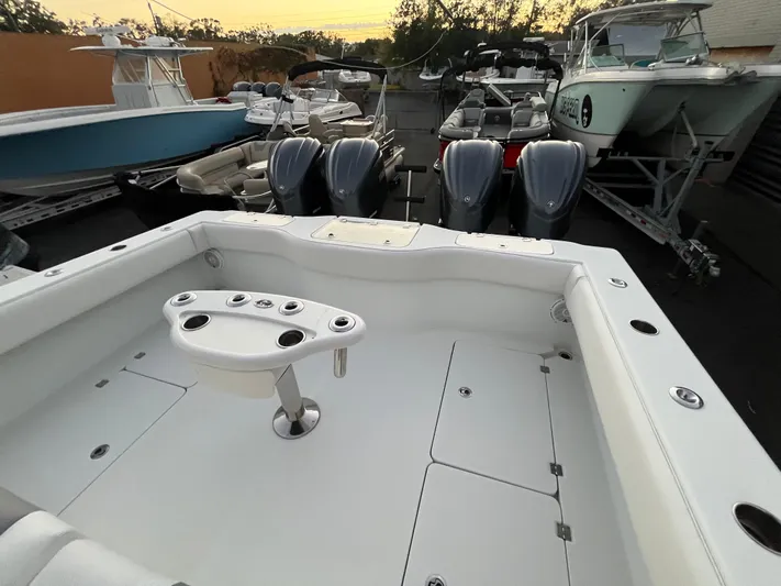  Yacht Photos Pics 2017 Freeman 37 VH boat deck with multiple outboard engines in a marina setting.