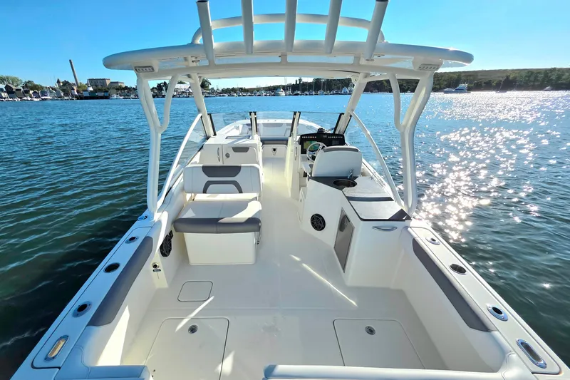  Yacht Photos Pics 2018 World Cat 280 DC-X boat on water, spacious deck, sunny day.