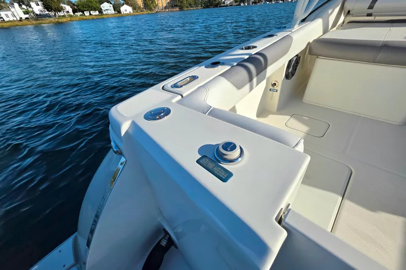  Yacht Photos Pics 2018 World Cat 280 DC-X boat interior with seating, on calm water.
