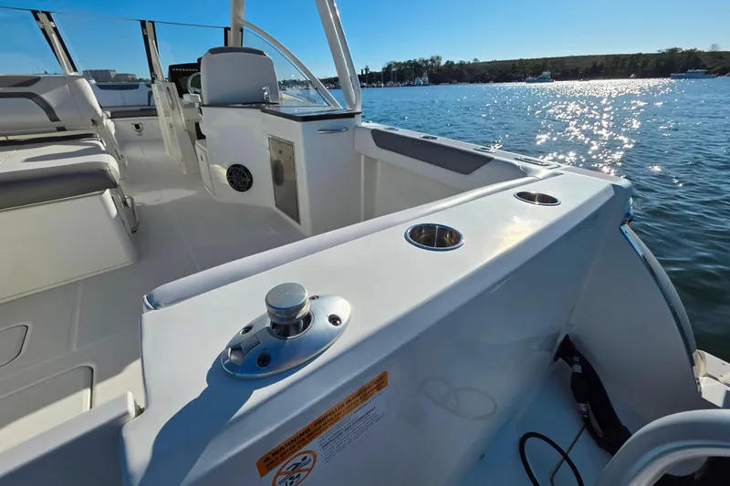  Yacht Photos Pics 2018 World Cat 280 DC-X boat interior with seating, cup holders, and water view.