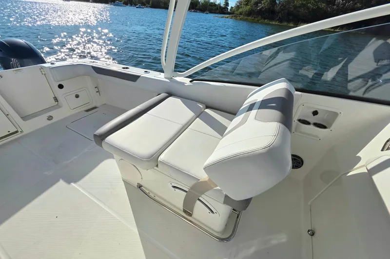  Yacht Photos Pics 2018 World Cat 280 DC-X boat interior with white seating and scenic water view.