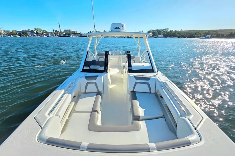  Yacht Photos Pics 2018 World Cat 280 DC-X boat on water, featuring spacious seating and Garmin equipment.