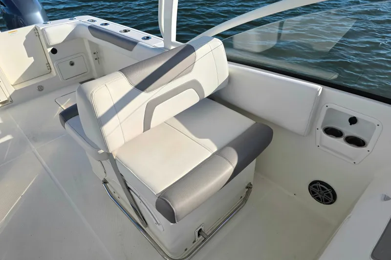  Yacht Photos Pics 2018 World Cat 280 DC-X boat interior with cushioned seating and cup holders.