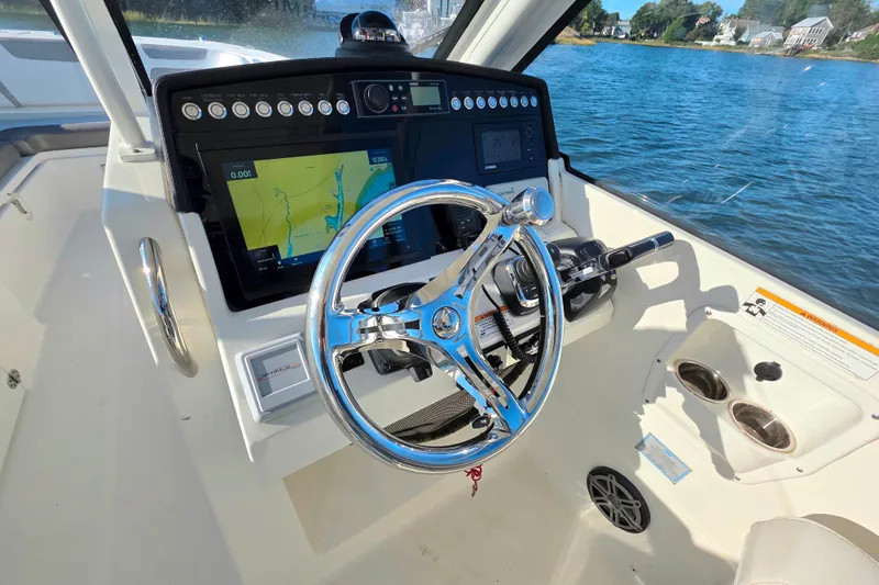  Yacht Photos Pics Helm of 2018 World Cat 280 DC-X with navigation display and steering wheel.