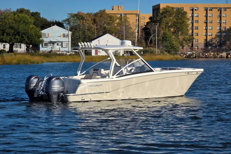  Yacht Photos Pics 2018 World Cat 280 DC-X boat on calm water with Yamaha engines.