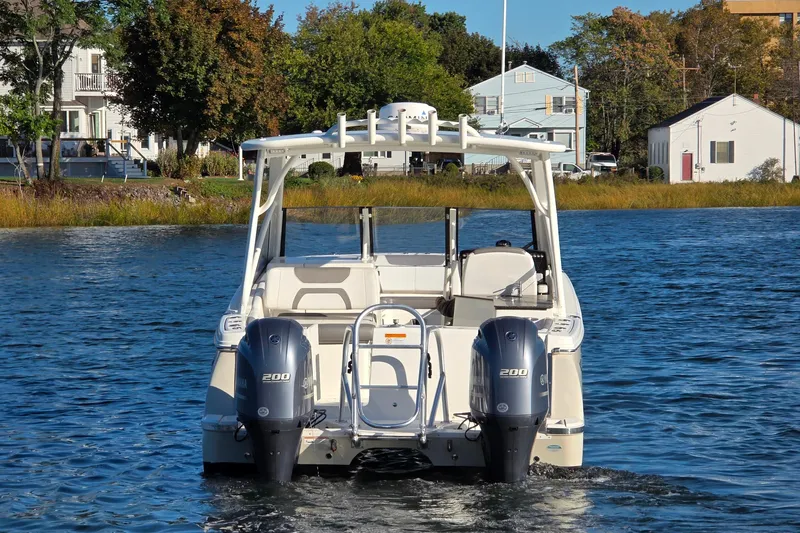  Yacht Photos Pics 2018 World Cat 280 DC-X boat on water, dual engines, scenic background.