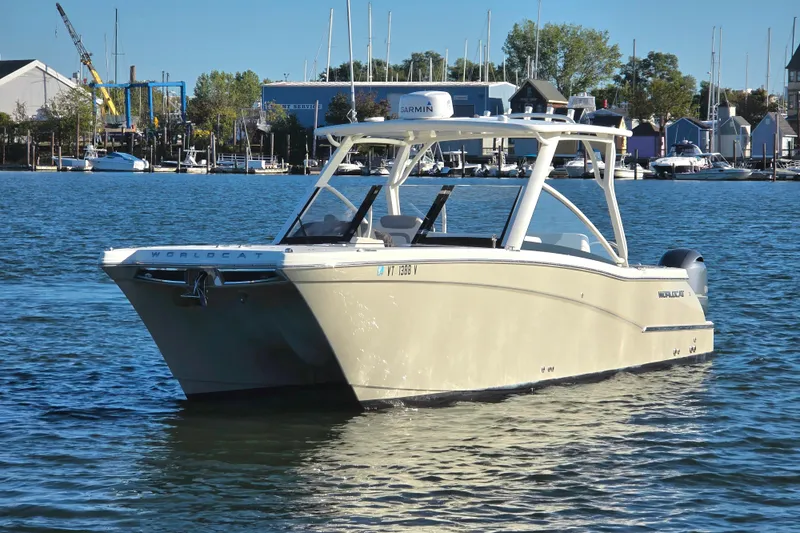  Yacht Photos Pics 2018 World Cat 280 DC-X boat on calm water near marina.