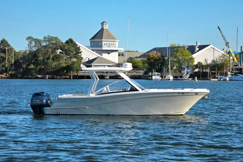  Yacht Photos Pics 2018 World Cat 280 DC-X boat on calm water near marina.