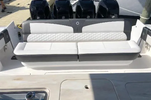  Yacht Photos Pics 2020 Fountain 43 NX boat with cushioned seating and multiple outboard engines.