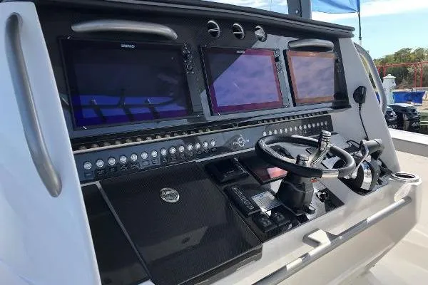  Yacht Photos Pics 2020 Fountain 43 NX boat dashboard with advanced navigation screens and controls.
