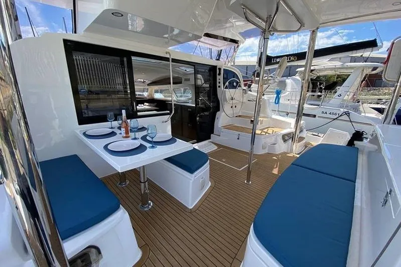 Laminic Yacht Photos Pics Luxurious 2022 Maverick Yachts 440 Custom interior with elegant seating and dining area.