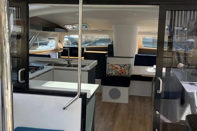 Laminic Yacht Photos Pics Interior of 2022 Maverick Yachts 440 Custom, featuring modern kitchen and seating area.