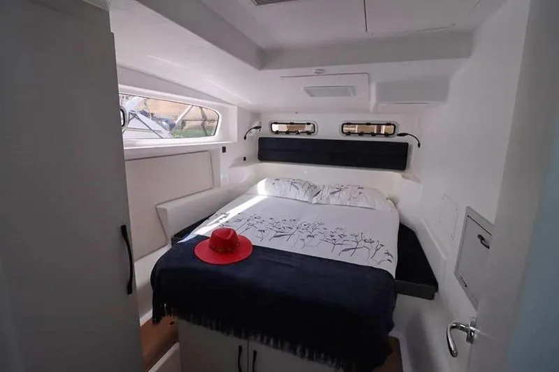 Laminic Yacht Photos Pics Luxurious cabin interior of 2022 Maverick Yachts 440 Custom with bed and red hat.