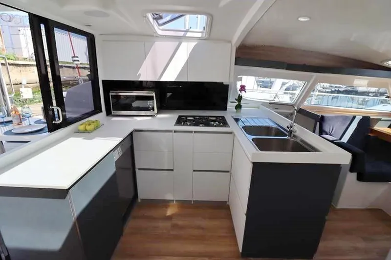 Laminic Yacht Photos Pics Modern kitchen interior of 2022 Maverick Yachts 440 Custom, featuring sleek design and appliances.