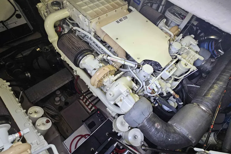  Yacht Photos Pics Engine room of a 2007 Sea Ray 60 Sundancer yacht, showcasing complex machinery and components.