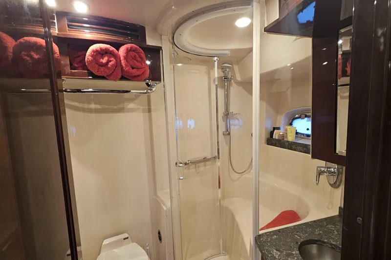 Yacht Photos Pics Luxurious bathroom in 2007 Sea Ray 60 Sundancer yacht with shower and elegant decor.