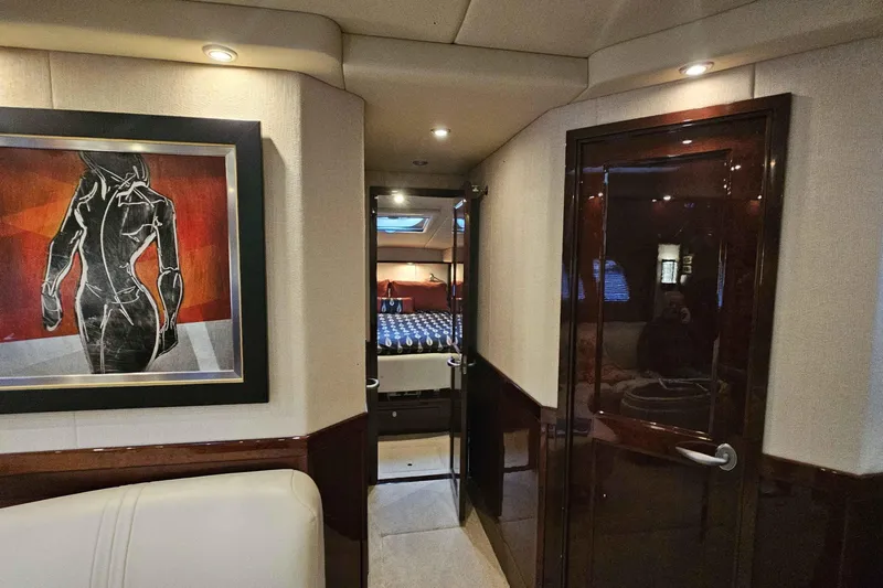 Yacht Photos Pics Luxurious interior of 2007 Sea Ray 60 Sundancer yacht with modern artwork and elegant design.