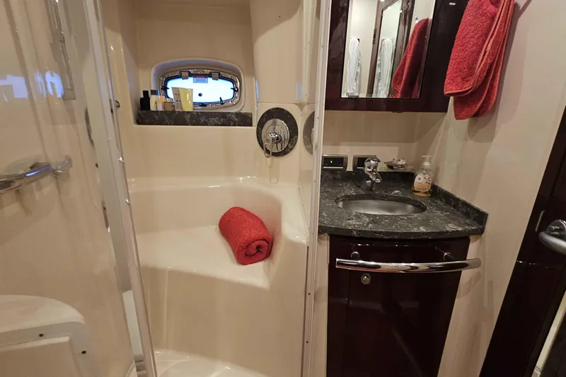  Yacht Photos Pics Luxurious bathroom in 2007 Sea Ray 60 Sundancer yacht with marble countertop and shower.