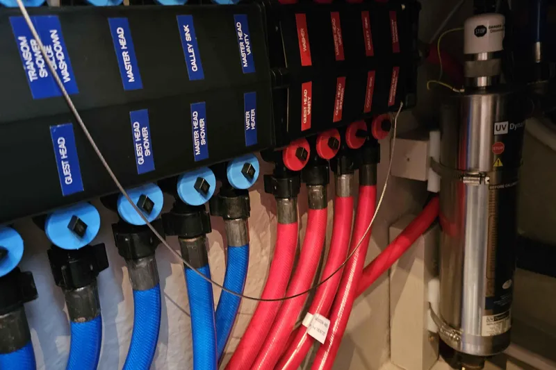  Yacht Photos Pics Water system plumbing in a 2007 Sea Ray 60 Sundancer yacht, featuring labeled pipes and UV filter.